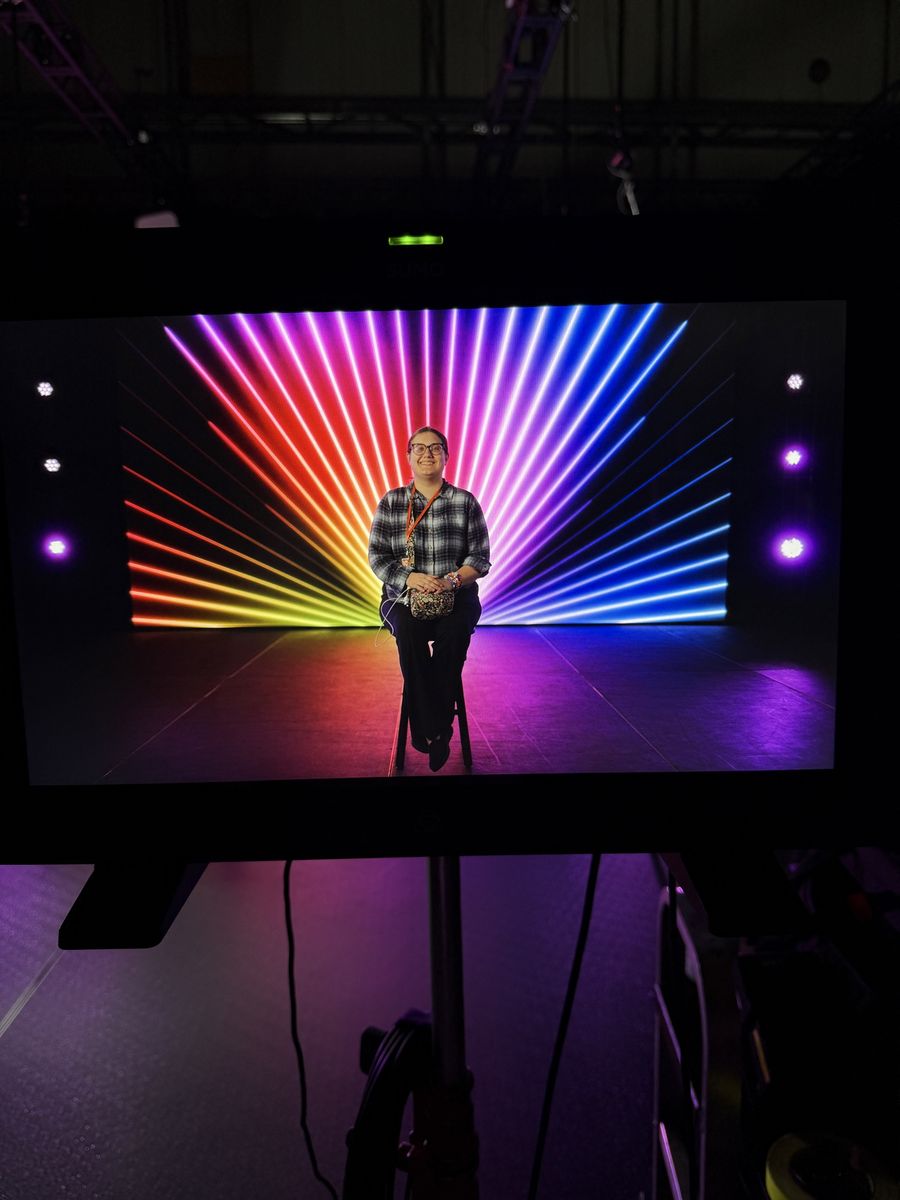 Studio interview setup with colorful stage lighting