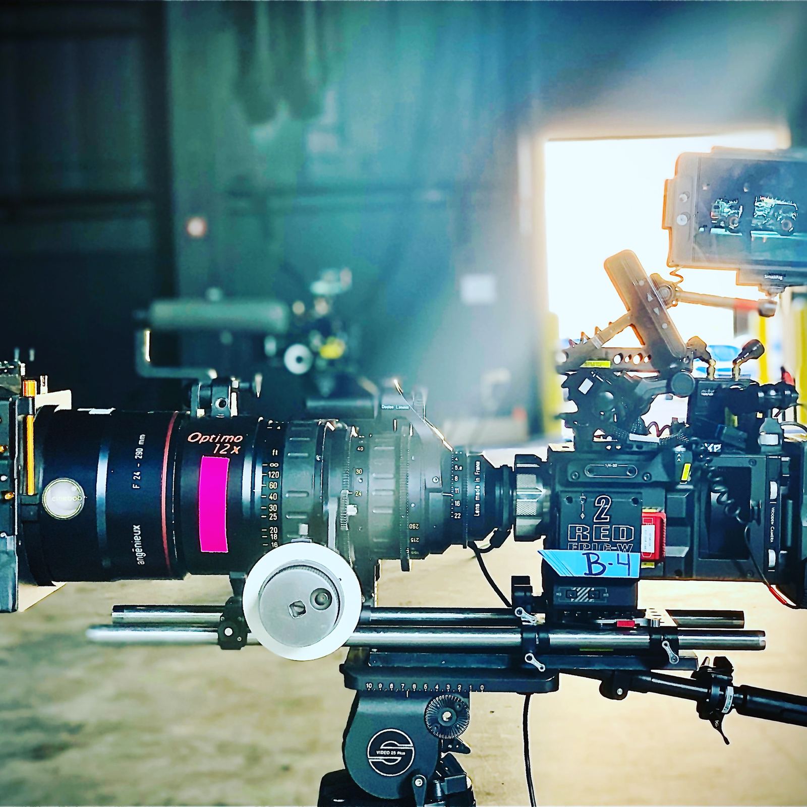 RED cinema camera with Angenieux Optimo zoom lens rigged for a shoot